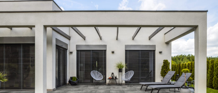 Outside,View,Of,Elegant,Suburban,House,With,Big,Window,Green Outside view of elegant suburban house with big window green lawn